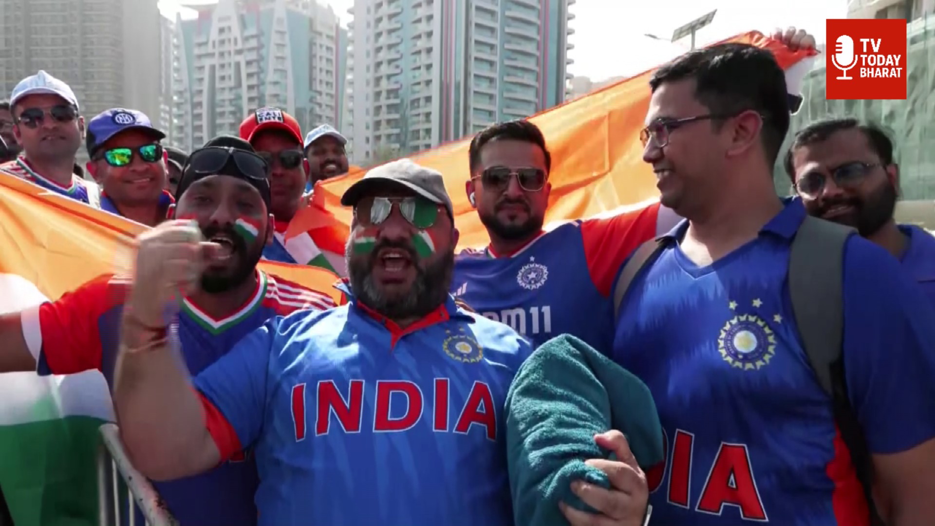 "Fans cheering at India vs Pakistan Asia Cup Final 2025 in Dubai stadium with colorful flags and banners."