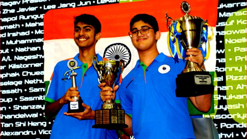 Madhav Gopal Kamath holding World Youth Scrabble Champion 2025 trophy after winning the championship in Kuala Lumpur.
