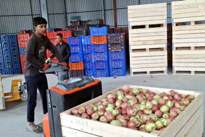 Apple crates stacked inside a cold storage facility in South Kashmir, where farmers are preserving their produce during the Srinagar–Jammu Highway shutdown.