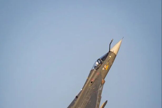 IAF Tejas fighter jet crashes during Dubai Airshow, thick smoke rises from crash site and emergency teams respond; pilot reported killed.