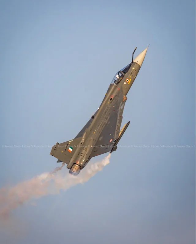 IAF Tejas fighter jet crashes during Dubai Airshow, thick smoke rises from crash site and emergency teams respond; pilot reported killed.