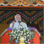 Prime Minister Narendra Modi delivering a speech in Bhutan on Delhi blast, vowing strict action against culprits; background visuals of Red Fort explosion site and security personnel inspecting the area.