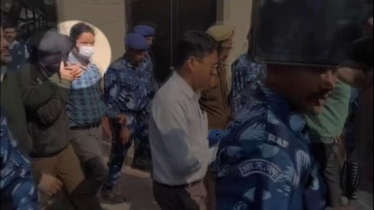 NIA officers escort accused Amir Rashid Ali under heavy security outside Patiala House Court in Delhi terror blast case.