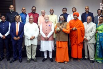 Prime Minister Narendra Modi interacting with Indian community leaders in Johannesburg during his South Africa visit for the G20 Summit.