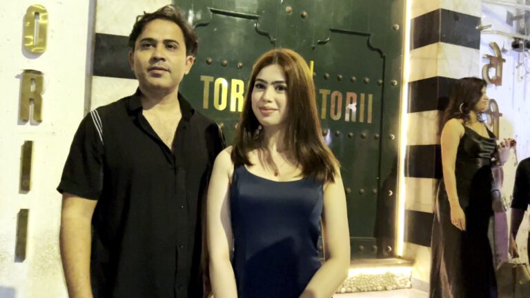 Riva Arora spotted outside Torii Restaurant in Mumbai, posing in a glamorous black-and-gold outfit with a radiant smile and confident style.