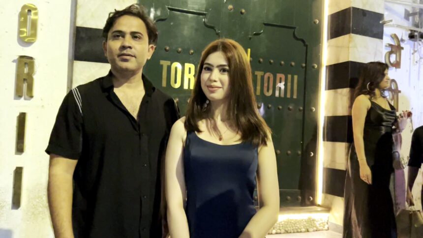 Riva Arora spotted outside Torii Restaurant in Mumbai, posing in a glamorous black-and-gold outfit with a radiant smile and confident style.