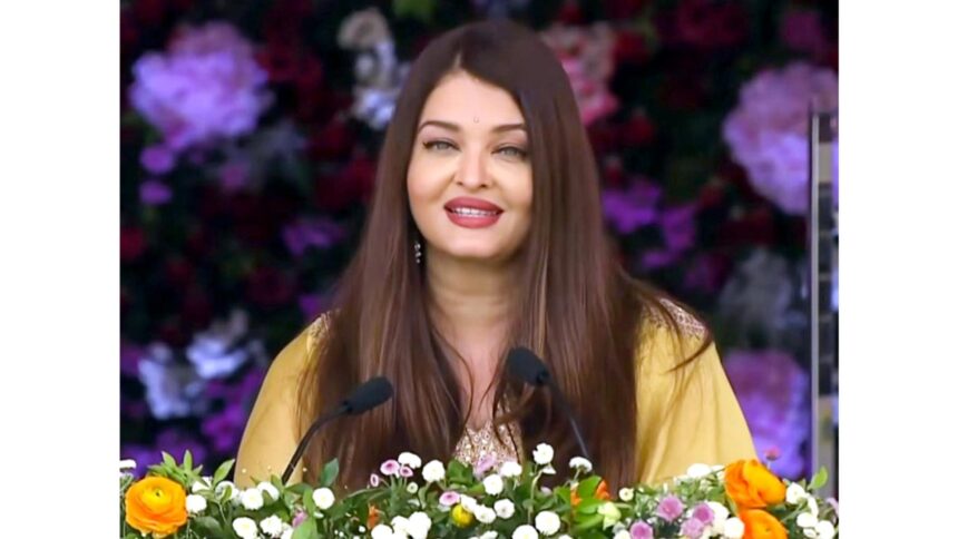 Aishwarya Rai Bachchan speaking at Sathya Sai Baba centenary celebrations, sharing Bal Vikas memories in a graceful traditional look.