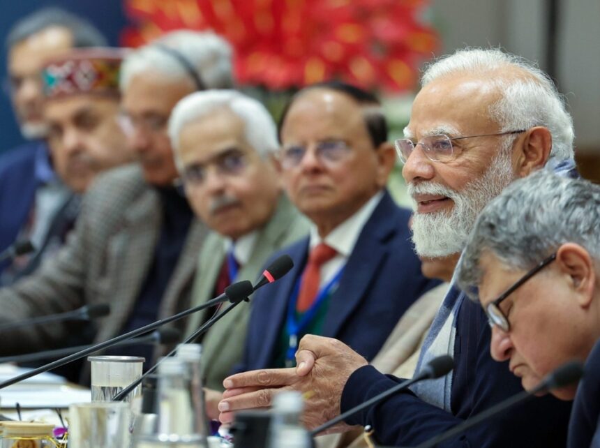 Prime Minister Narendra Modi interacting with leading economists and experts during a high-level meeting at NITI Aayog on the Viksit Bharat 2047 roadmap, focusing on Aatmanirbharta, structural reforms, AI, and economic growth.