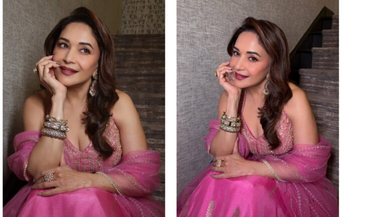 Madhuri Dixit smiling gracefully in a pink lehenga while posing for Instagram photos, showcasing her elegant traditional look