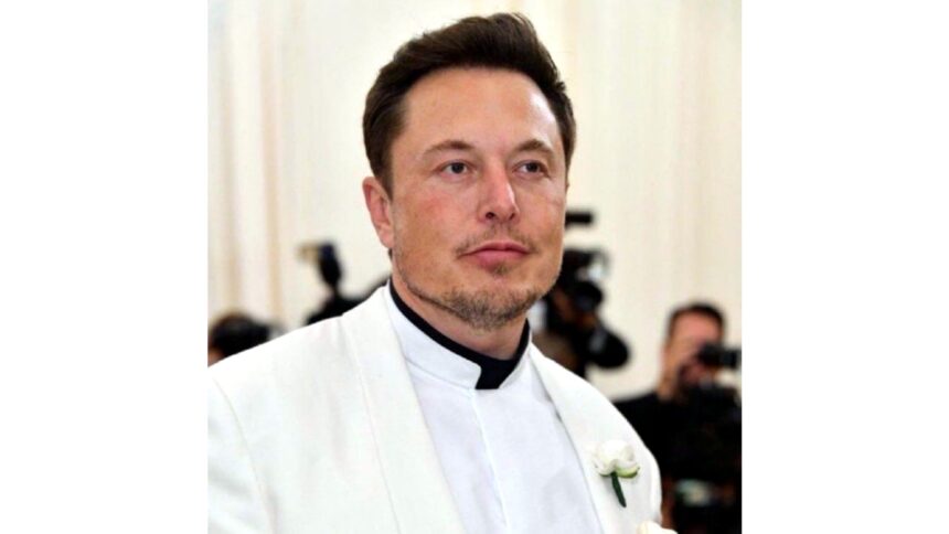 Elon Musk smiling during a business event as his net worth rises close to 750 billion dollars due to Tesla and SpaceX growth