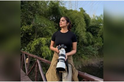 Malavika Mohanan smiling during her Tadoba safari with camera full of tiger photos