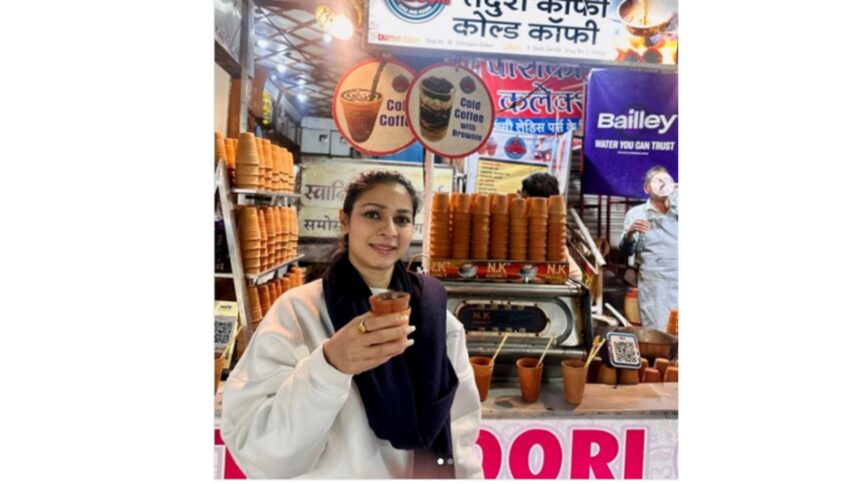 Tanisha Mukerjee enjoying kulhad tea in winter, showcasing desi glamour street style look
