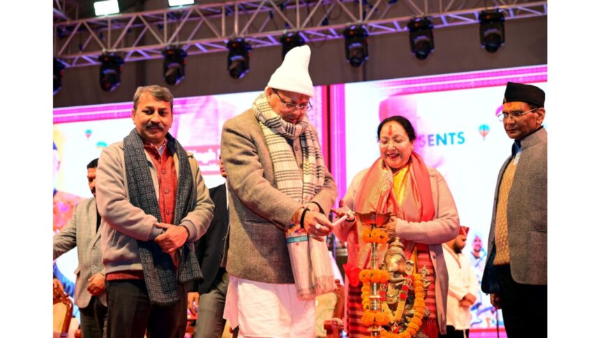 Chief Minister Pushkar Singh Dhami addressing people at Nainital Winter Carnival 2025 with Uttarakhand folk cultural performances in the background.