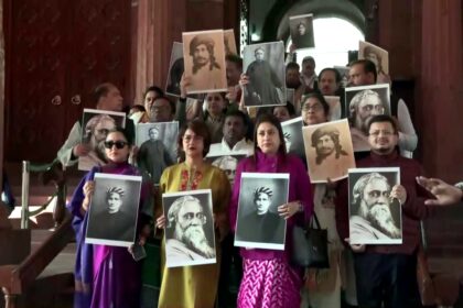 TMC MPs holding photos of Rabindranath Tagore and Bankim Chandra Chatterjee during Vande Mataram debate in Parliament