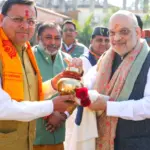 Amit Shah was presented a sacred Ganga Jal Kalash before his Delhi departure, symbolizing Uttarakhand’s culture, faith, development vision.