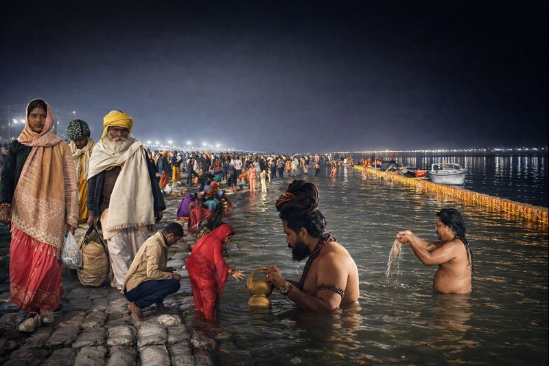 Paush Purnima Magh Mela holy bath at Triveni Sangam Prayagraj with thousands of devotees taking a sacred dip