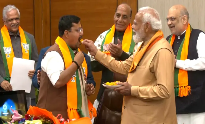 Prime Minister Narendra Modi meets Nitin Nabin and his family at BJP headquarters after he takes charge as BJP National President in New Delhi.