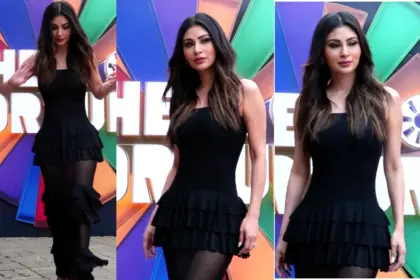 Mouni Roy posing in a glamorous and elegant outfit on the Wheel of Fortune set in Mumbai during the show shoot.