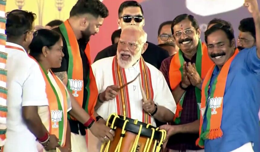 Palakkad Kerala BJP Rally: BJP leader addressing large crowd at Palakkad Kerala rally with party flags and supporters