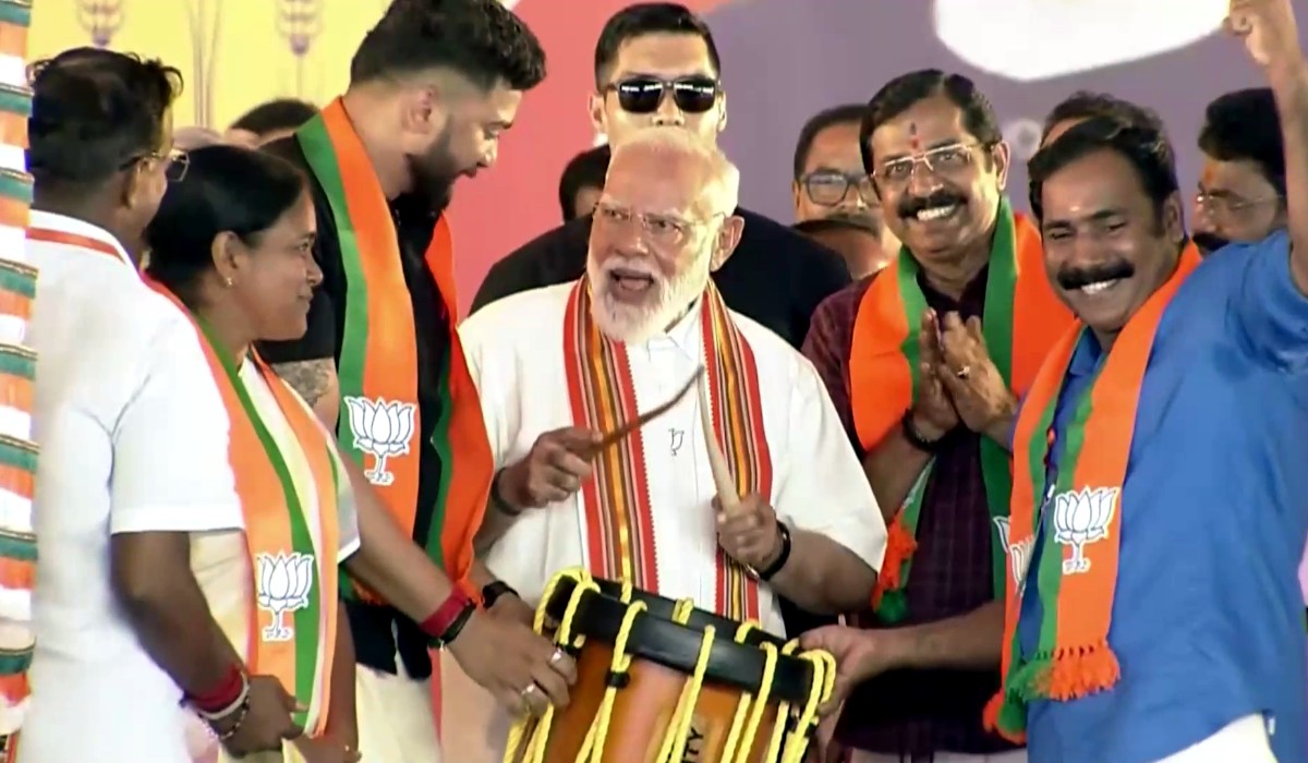 Palakkad Kerala BJP Rally: BJP leader addressing large crowd at Palakkad Kerala rally with party flags and supporters