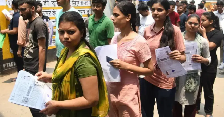 CUET-UG 2026: Students waiting outside a CUET UG 2026 examination center after technical issues delayed the test.
