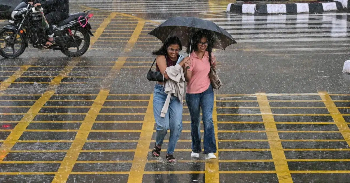 Monsoon Rain Alert: Dark monsoon clouds covering the sky over an Indian city as heavy rainfall and thunderstorms approach during an active monsoon weather system.