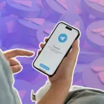 Telegram logo displayed on a smartphone with legal documents in the background, highlighting the Telegram Ban in India