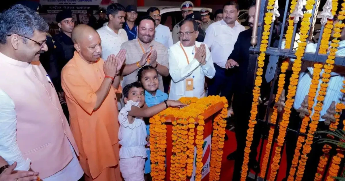 CM Yogi Moradabad Visit: Chief Minister Yogi Adityanath with two young girls during the inauguration of Shri Ram Vatika in Moradabad, highlighting support for children's education and empowerment.