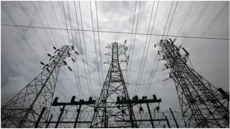 Delhi Electricity Price Hike: Electricity meter and power transmission lines representing hike and increased electricity bills in Delhi.