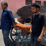 Farrukhabad Bank Incident: Broken-legged 73-year-old woman being taken on a handcart to a Punjab National Bank branch by her son and grandson for pension withdrawal in Farrukhabad, Uttar Pradesh.