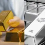 Gold Price Drop: Gold jewelry and silver bars displayed at a bullion shop after a sharp decline in gold and silver prices.