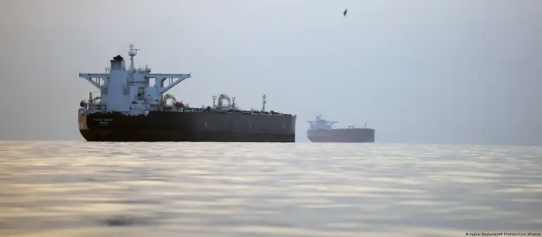 Commercial oil tankers and cargo ships passing through the Hormuz Strait as Oman discusses possible shipping service charges