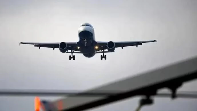 Iran War Impact : Commercial airplanes parked at an international airport amid concerns over rising fuel costs