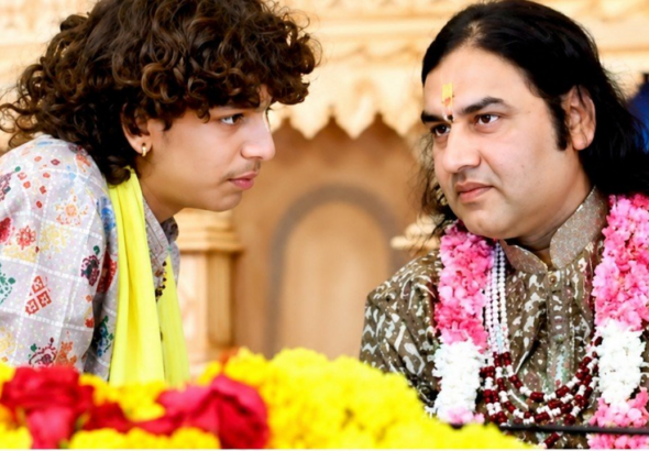 Devansh Thakur Bhagavad Gita on stage while Devkinandan Thakur watches during a religious event in Somnath| D_N THAKUR ‘X’