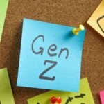 Gen Z Marketing Strategy: Young Gen Z users using Instagram on smartphones as brands increase digital marketing and social media advertising strategies.