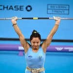 Mirabai Chanu Commonwealth Games celebrates after winning her third consecutive Commonwealth Games gold medal in women's weightlifting.