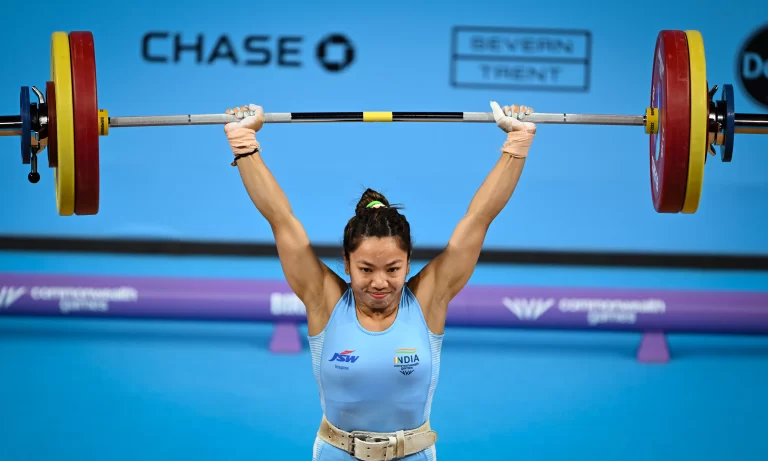 Mirabai Chanu Commonwealth Games celebrates after winning her third consecutive Commonwealth Games gold medal in women's weightlifting.
