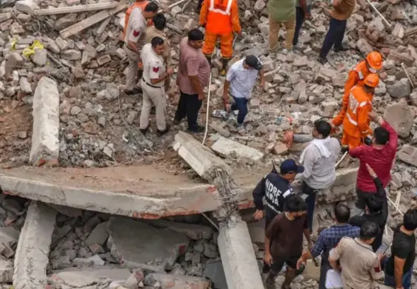 Rohini Building Collapse: Rescue teams clearing debris after the Rohini Building Collapse in Delhi, where an under-construction four-storey building collapsed, leaving multiple casualties and triggering a large-scale rescue operation.