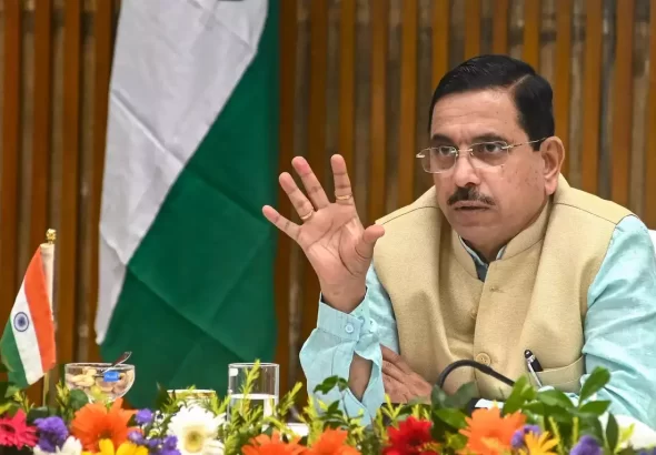 Prahlad Joshi addressing the media after receiving additional charge of the Education Ministry following Dharmendra Pradhan's resignation.