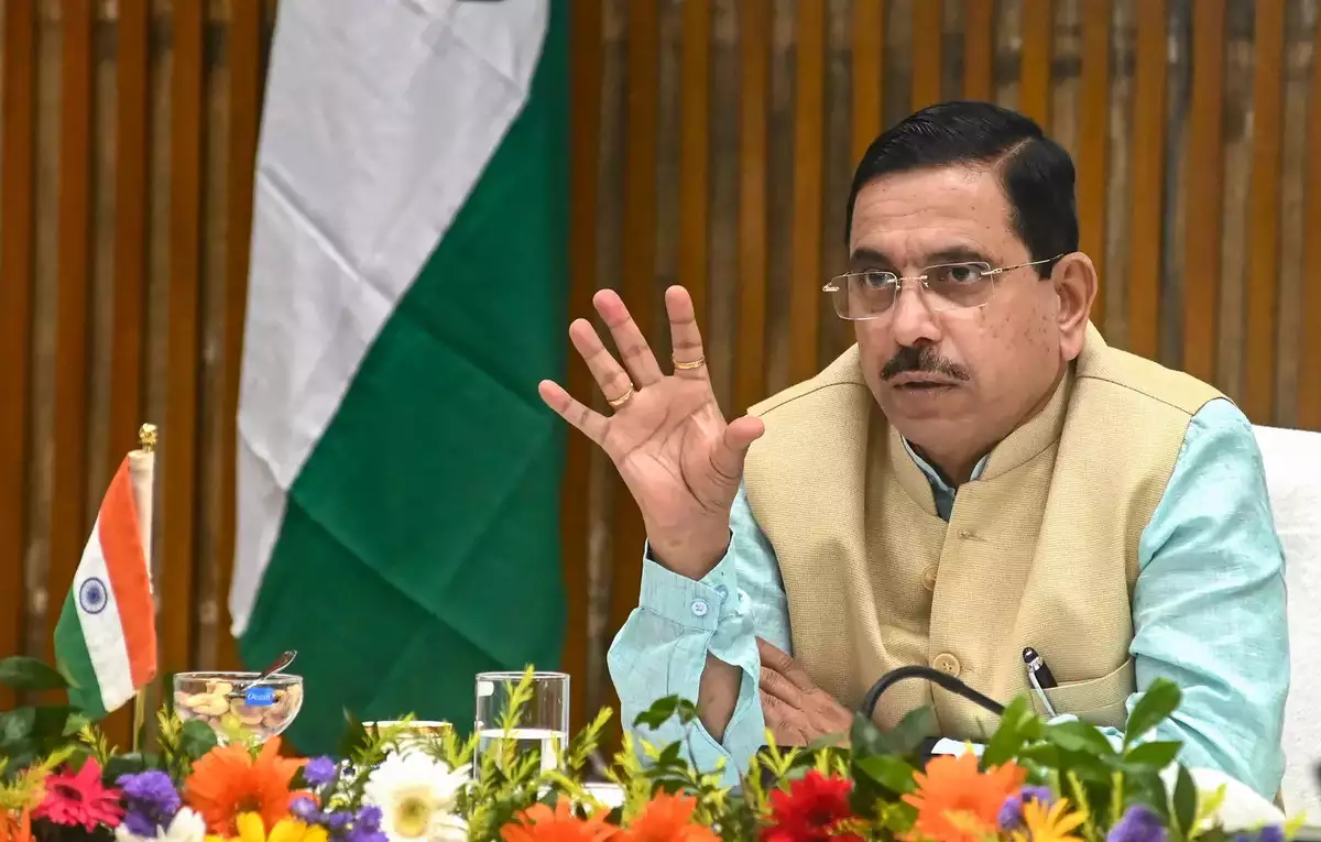 Prahlad Joshi addressing the media after receiving additional charge of the Education Ministry following Dharmendra Pradhan's resignation.